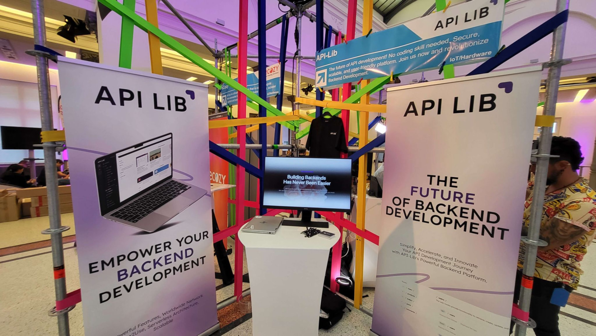 API-Lib trade fair stand with roll-ups and a live demo